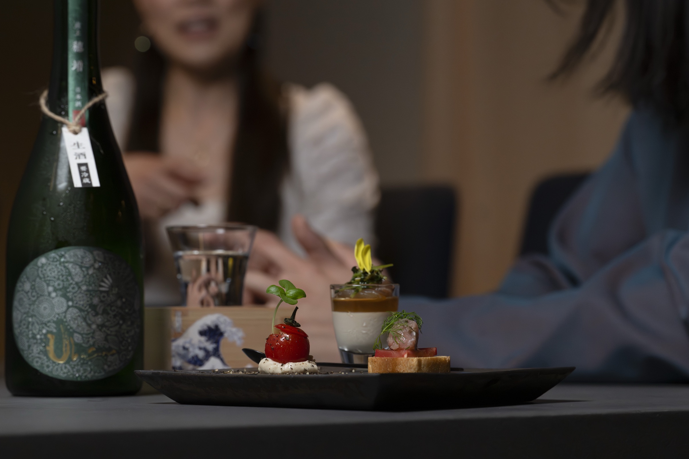 A plated dish paired with the opening sake selection