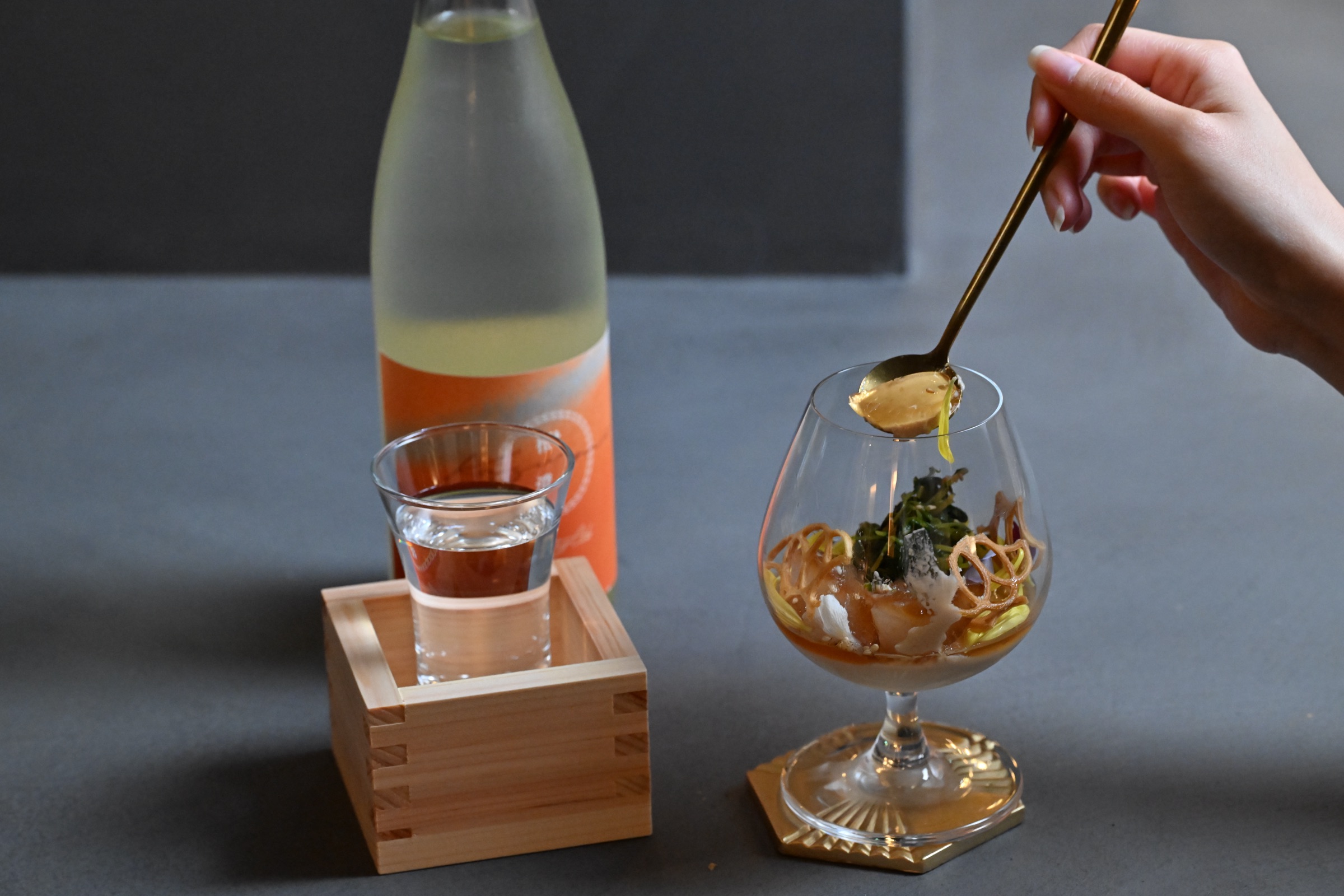 A mid-course pairing with a richer sake pour